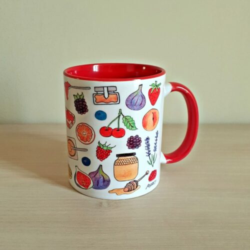 Taza de cerámica de colores con una ilustración artesanal dedicada a las mermeladas.