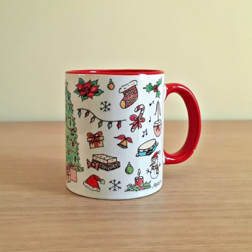 Taza de cerámica de colores con una ilustración artesanal dedicada a la Navidad