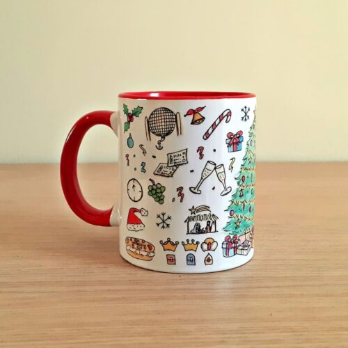 Taza de cerámica de colores con una ilustración artesanal dedicada a la Navidad vista trasera